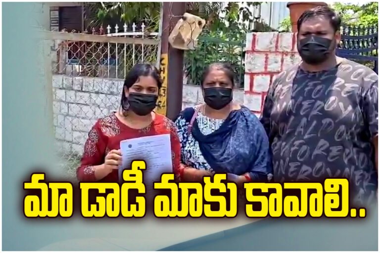 MRO Giribabu row as wife and kids protest near Hanumakonda Police Station, alleging live-in relationship and neglect.